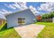Backyard with concrete patio, sliding glass door and partial view of fenced yard at 3010 Egrets Landing Dr, Lake Mary, FL 32746