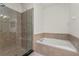 Bathroom featuring a large soaking tub and a glass-enclosed shower at 3010 Egrets Landing Dr, Lake Mary, FL 32746