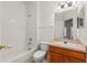 Well lit bathroom featuring a bathtub, toilet, vanity with mirror and a decorative light fixture at 3010 Egrets Landing Dr, Lake Mary, FL 32746