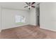 Bedroom with neutral walls, ceiling fan, carpet, and a bright window view at 3010 Egrets Landing Dr, Lake Mary, FL 32746