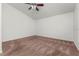Bedroom features neutral walls and carpet, with ceiling fan and ample natural light at 3010 Egrets Landing Dr, Lake Mary, FL 32746
