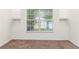 Bedroom with neutral carpet, large window and built in shelving features at 3010 Egrets Landing Dr, Lake Mary, FL 32746
