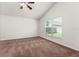Bedroom with a vaulted ceiling, neutral carpet, and a bright window view at 3010 Egrets Landing Dr, Lake Mary, FL 32746