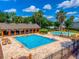 A full view of the community pool, splashpad, clubhouse and patio seating at 3010 Egrets Landing Dr, Lake Mary, FL 32746