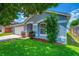 Beautiful one-story home with a blue exterior, manicured landscaping, and a two-car garage at 3010 Egrets Landing Dr, Lake Mary, FL 32746