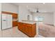 Kitchen with a breakfast bar, tiled floor, and access to a sunlit outdoor space at 3010 Egrets Landing Dr, Lake Mary, FL 32746