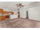 Open concept: Living room with view of kitchen, breakfast bar, and neutral carpeting at 3010 Egrets Landing Dr, Lake Mary, FL 32746