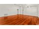 Well-lit living room with hardwood floors, neutral walls, and an open doorway at 3010 Egrets Landing Dr, Lake Mary, FL 32746