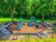 View of the community playground featuring a slide and climbing equipment surrounded by a mulch base at 3010 Egrets Landing Dr, Lake Mary, FL 32746