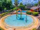 Aerial view of community splashpad, colorful play structure and seating areas at 3010 Egrets Landing Dr, Lake Mary, FL 32746