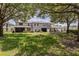 Large backyard with lush green grass and mature trees at 1062 Wickerwood St, Ocoee, FL 34761
