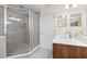Bathroom showcasing a glass-enclosed shower and vanity with modern fixtures at 1062 Wickerwood St, Ocoee, FL 34761