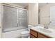 Bathroom vanity with a tub and shower combination at 1062 Wickerwood St, Ocoee, FL 34761