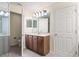 Bathroom featuring a vanity with dual sinks and a shower at 1062 Wickerwood St, Ocoee, FL 34761