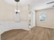 Bright dining room with wood floors and hanging light fixture at 1062 Wickerwood St, Ocoee, FL 34761