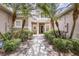 Inviting entrance with mature landscaping and a well-maintained walkway leading to the front door at 1062 Wickerwood St, Ocoee, FL 34761
