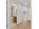 Hallway view into bathroom and living room with ceiling fans at 1062 Wickerwood St, Ocoee, FL 34761