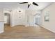 Bright living room with wood floors, ceiling fan, and sliding glass doors at 1062 Wickerwood St, Ocoee, FL 34761