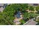 Community playground with play structures surrounded by lush greenery at 1062 Wickerwood St, Ocoee, FL 34761