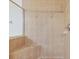 Walk-in shower with tiled walls and built-in bench at 1062 Wickerwood St, Ocoee, FL 34761