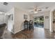 Bright dining area featuring a ceiling fan, sliding glass doors to the outside, and stylish hardwood flooring at 1198 E Hancock Dr, Deltona, FL 32725