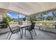 Enclosed patio with outdoor dining furniture, perfect for enjoying the beautiful surrounding view at 1198 E Hancock Dr, Deltona, FL 32725