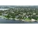 Scenic aerial view of lakeside homes with docks and lush green surroundings at 1271 Old Mill Rd, Orlando, FL 32806