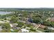 Beautiful aerial view of a suburban home with a lush green lawn and mature trees at 1271 Old Mill Rd, Orlando, FL 32806