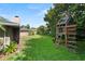Large backyard includes play structure and mature landscaping at 1271 Old Mill Rd, Orlando, FL 32806