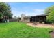 The lovely backyard offers a fire pit area, screened porch, and playset for endless outdoor fun at 1271 Old Mill Rd, Orlando, FL 32806