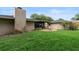 The spacious backyard features a brick patio with a fire pit, screened porch, and lush lawn at 1271 Old Mill Rd, Orlando, FL 32806