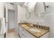 Bright bathroom with granite counters, double sinks, and white tiled walls at 1271 Old Mill Rd, Orlando, FL 32806