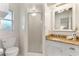 Bright bathroom features a stand up shower, granite counters, and white tile walls at 1271 Old Mill Rd, Orlando, FL 32806