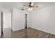 Bright bedroom featuring wood-look flooring, ceiling fan, closet and neutral wall color at 1271 Old Mill Rd, Orlando, FL 32806