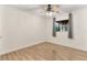 This empty bedroom features a window, gray curtains, and hardwood floors at 1271 Old Mill Rd, Orlando, FL 32806
