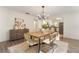 Dining area with hardwood floors, neutral colors, and views of the kitchen at 1271 Old Mill Rd, Orlando, FL 32806