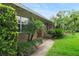 Brick house with well-maintained landscaping, featuring lush greenery and mature trees around the property at 1271 Old Mill Rd, Orlando, FL 32806