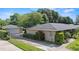 View of a well-maintained house with a detached garage, offering ample parking at 1271 Old Mill Rd, Orlando, FL 32806