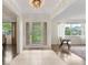 Bright foyer showcasing tile flooring, a decorative glass front door, and an open view into the living spaces at 1271 Old Mill Rd, Orlando, FL 32806
