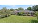 Charming brick home featuring a well-manicured lawn and mature landscaping at 1271 Old Mill Rd, Orlando, FL 32806