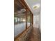 The brick hallway features brick flooring and a view of the outdoor patio area at 1271 Old Mill Rd, Orlando, FL 32806