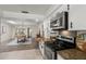 Open kitchen with granite countertops, stainless steel appliances and an adjoining dining room at 1271 Old Mill Rd, Orlando, FL 32806