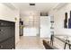 This laundry room features unique tile flooring and modern appliances at 1271 Old Mill Rd, Orlando, FL 32806