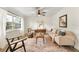Cozy living room with stylish furnishings, natural light, and a ceiling fan for added comfort at 1271 Old Mill Rd, Orlando, FL 32806