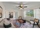 Comfortable living room showcasing natural light, stylish furniture, and hardwood floors at 1271 Old Mill Rd, Orlando, FL 32806