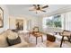 Bright and airy living room with stylish seating, natural light, and a seamless flow to other living areas at 1271 Old Mill Rd, Orlando, FL 32806