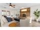 The living room features a brick fireplace, hardwood floors, and a ceiling fan at 1271 Old Mill Rd, Orlando, FL 32806