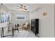 Office space featuring patterned floors, modern desk, shelving, and a neutral paint scheme at 1271 Old Mill Rd, Orlando, FL 32806