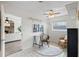 Office space featuring natural light, modern flooring, ceiling fan, and access to the living room at 1271 Old Mill Rd, Orlando, FL 32806