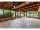 Covered patio featuring brick flooring, wood ceilings, ceiling fans, and outdoor views at 1271 Old Mill Rd, Orlando, FL 32806